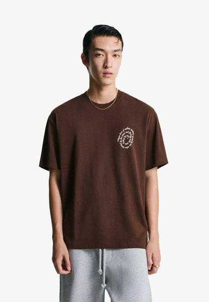 Bershka dark brown short-sleeve t-shirt with a small circular graphic on the tront chest.